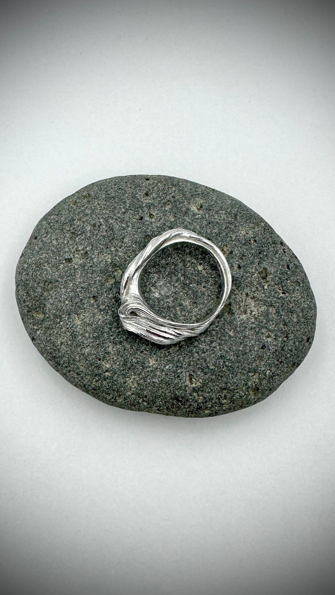 Top-down view of Flow State Sterling Silver Ring showing complex layered wax texture, size T