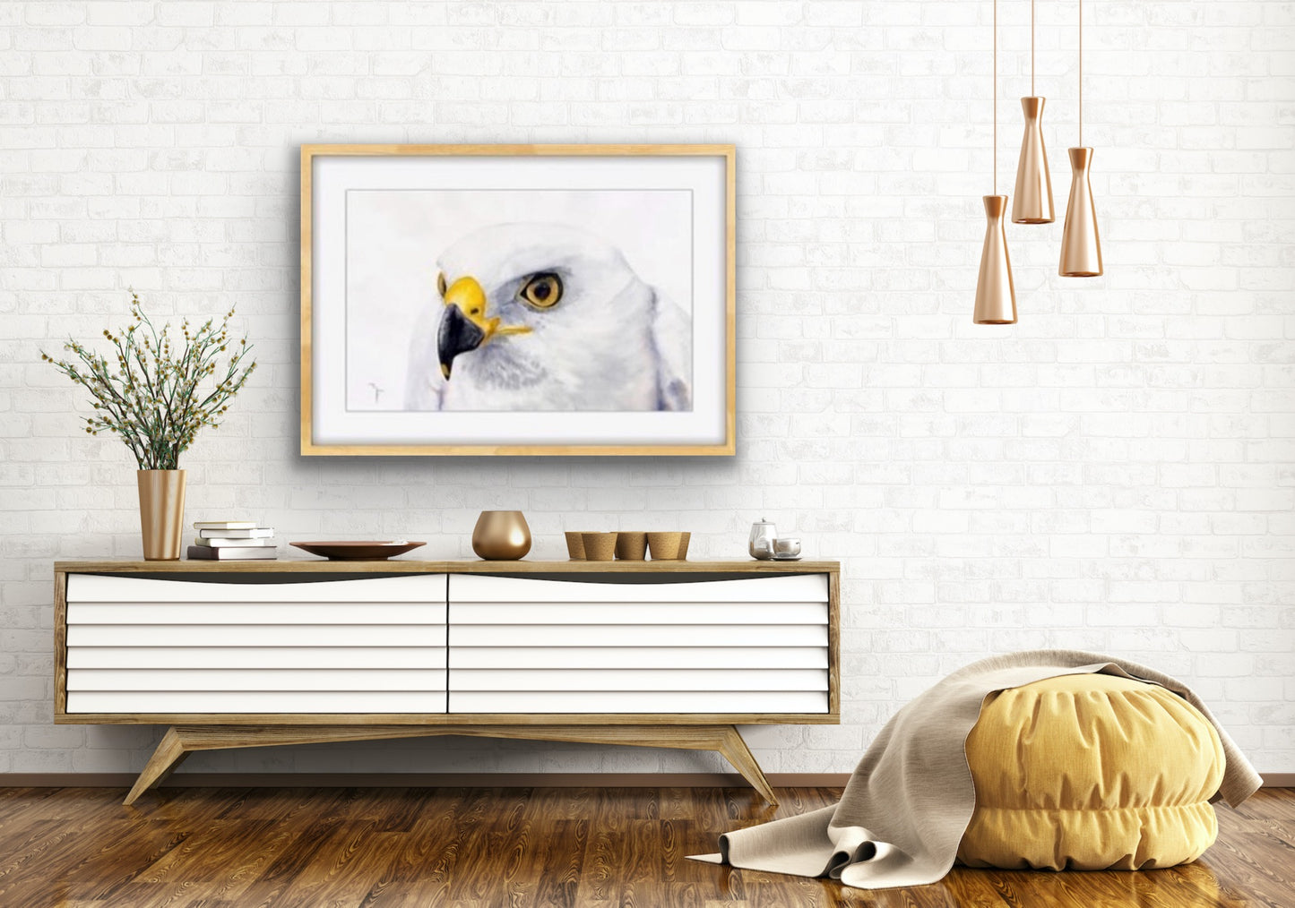 'White Ghost' White Morph Grey Goshawk fine art print by Marina Fox, framed in natural timber, displayed above a Scandinavian-style sideboard in a bright white living room