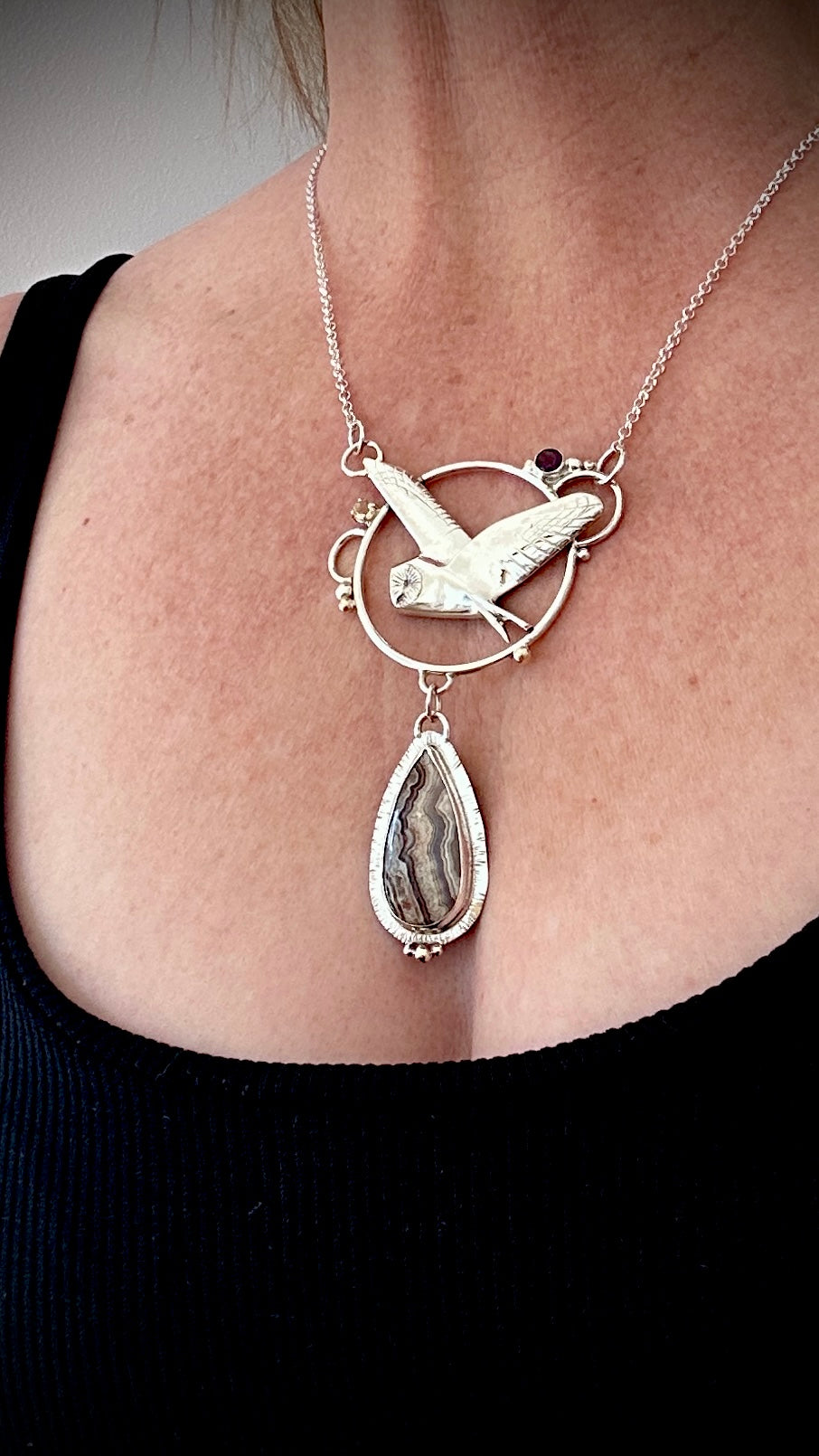 Close-up of Barn Owl Pendant in sterling silver with faceted Amethyst and Citrine gemstones