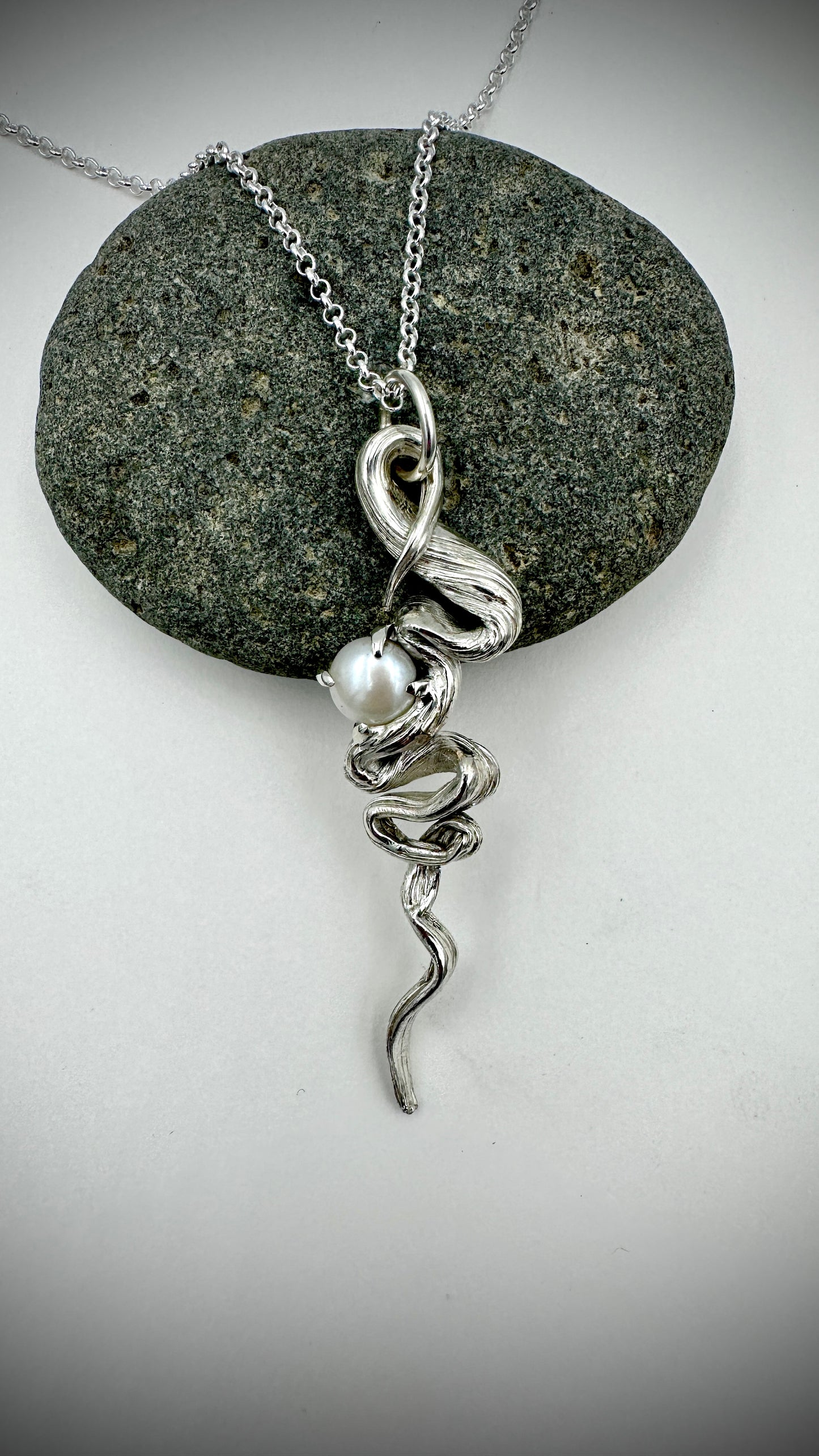 Detail of hand-twisted Mitsuro Hikime silver pendant with 10mm white Freshwater Pearl accent