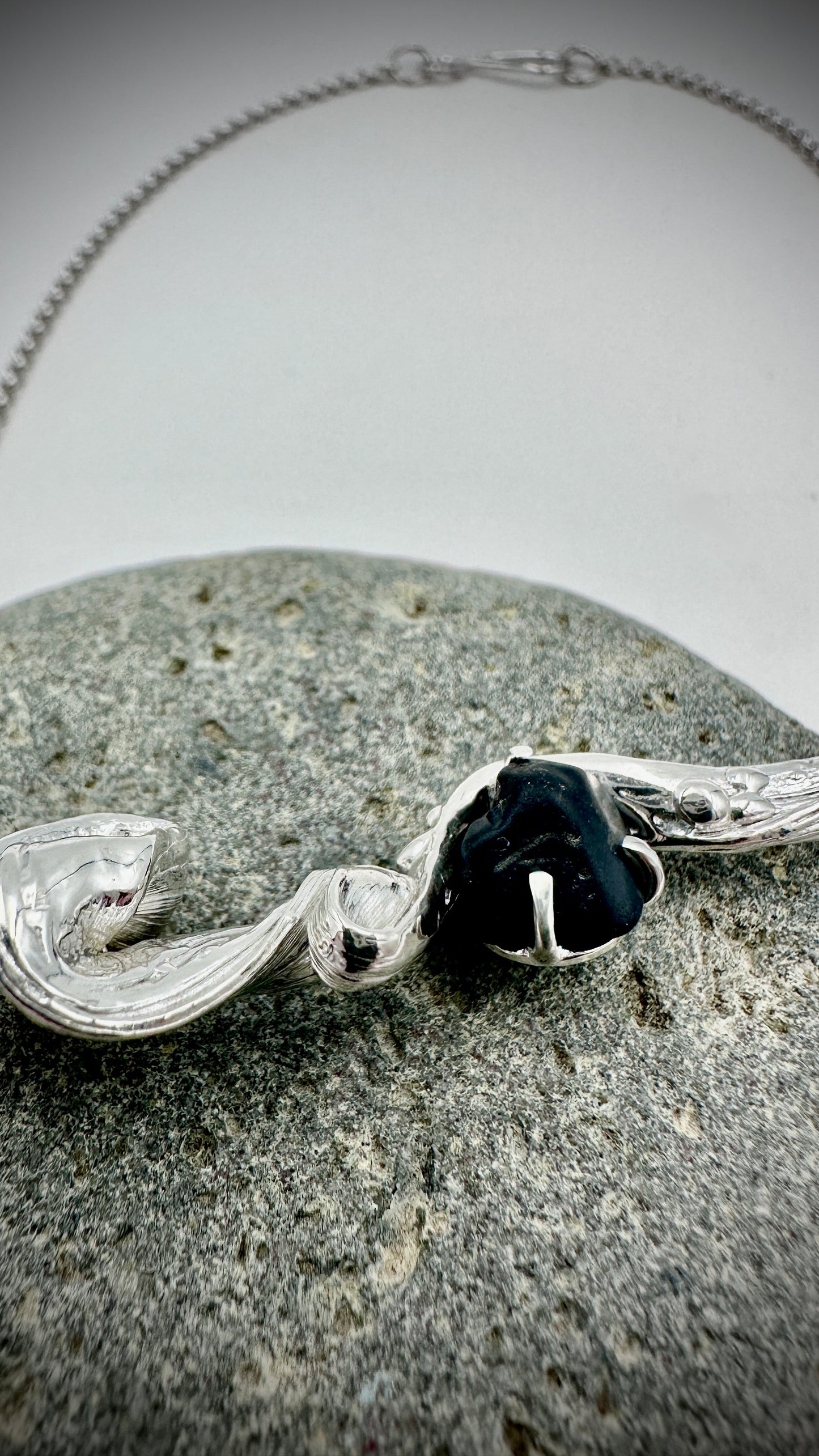 Detail shot of hand-twisted Mitsuro Hikime silver pendant with Black Spinel accent stone – Marina Fox Fine Art