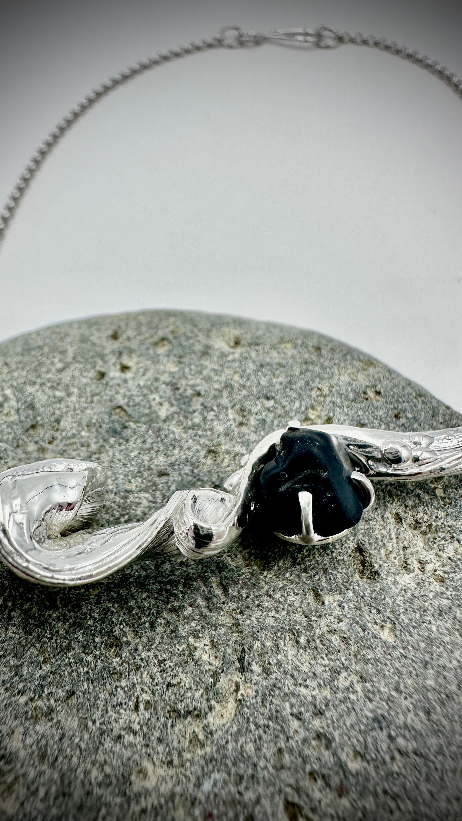 Detail shot of hand-twisted Mitsuro Hikime silver pendant with Black Spinel accent stone – Marina Fox Fine Art