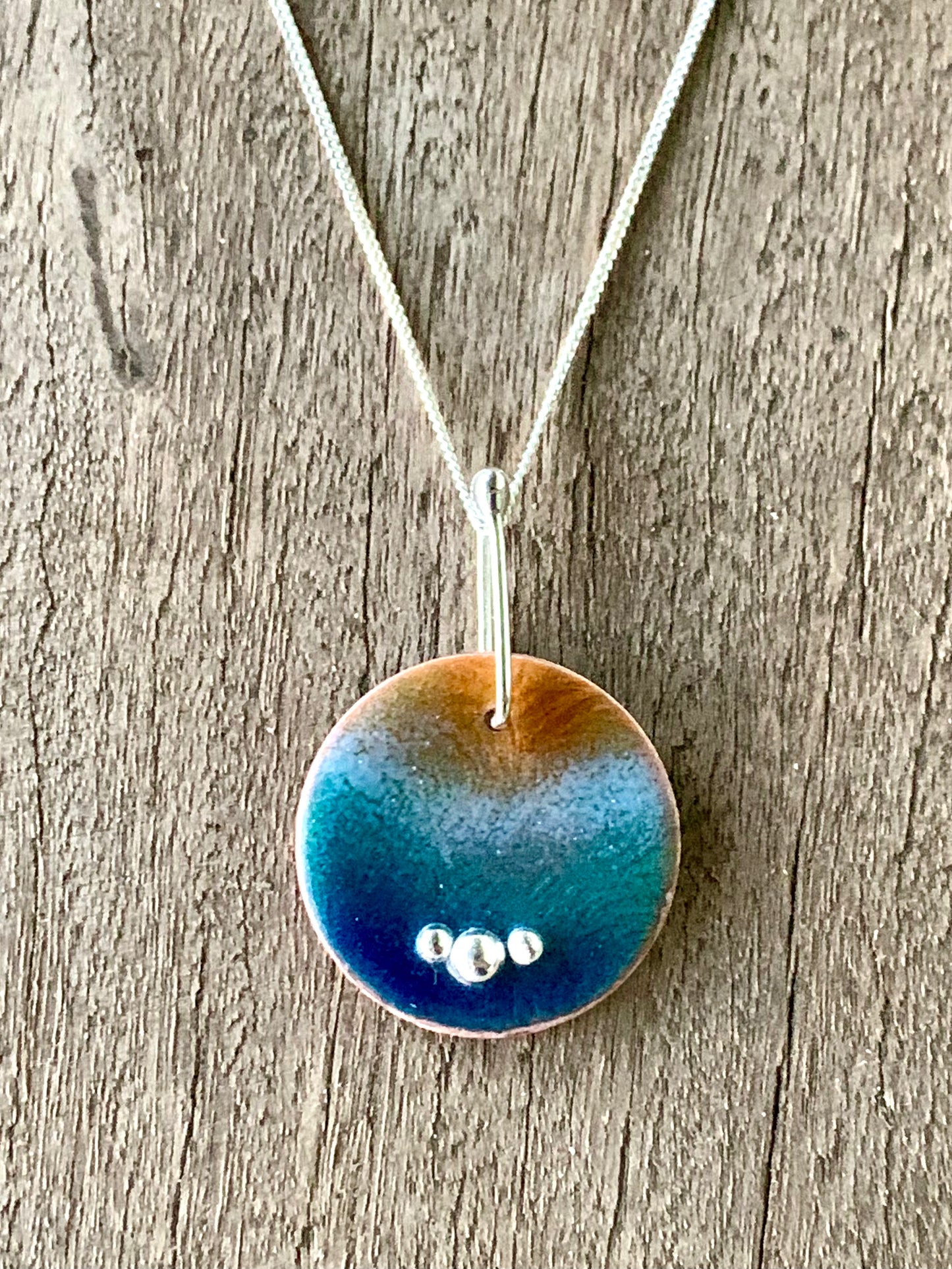 Handmade enamelled beach pendant – copper disk with ocean wave enamel and sterling silver bubbles – Marina Fox Fine Art