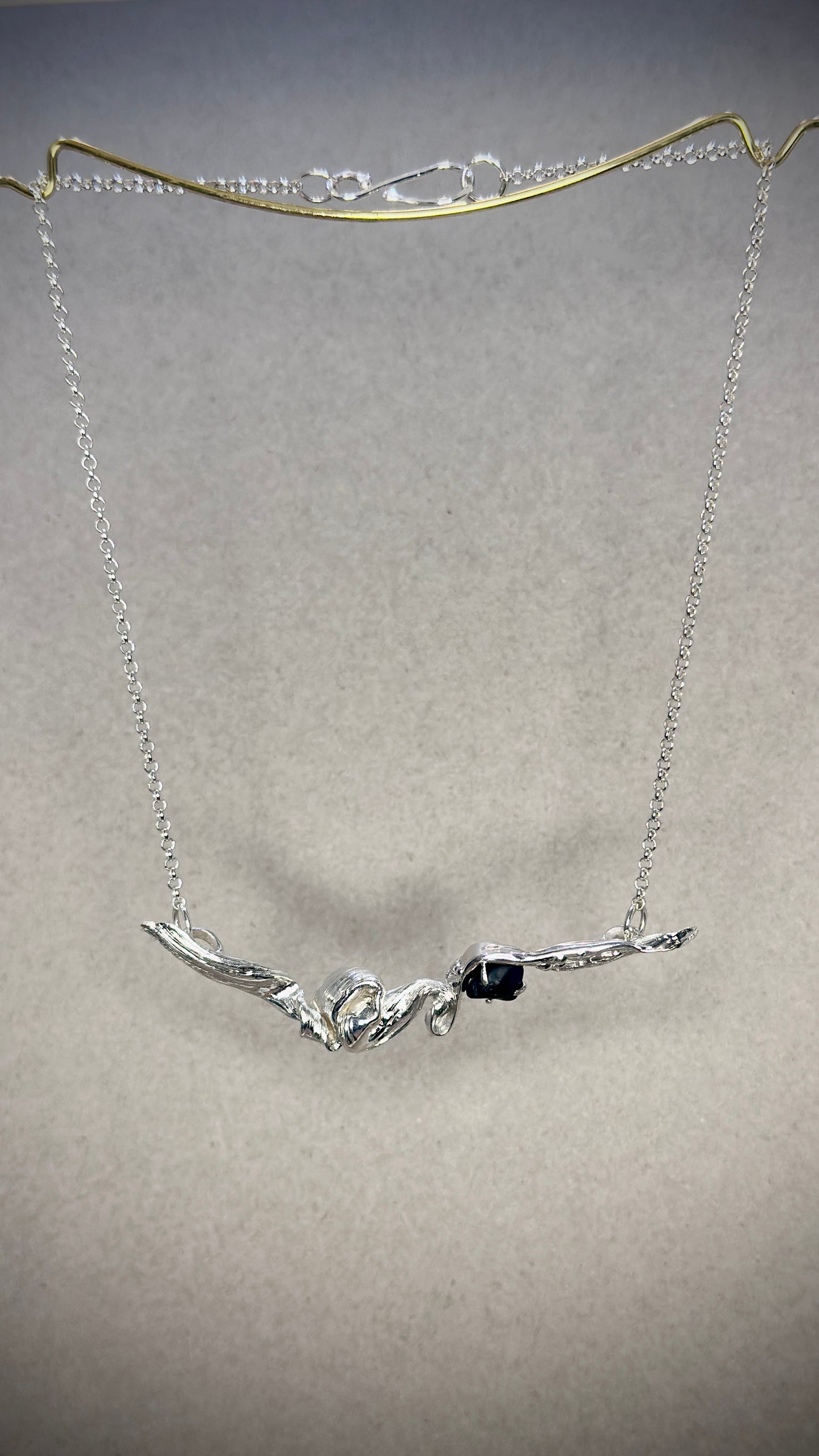 Mitsuro Hikime flowing silver lines on Flow State Trail pendant with Black Spinel gemstone
