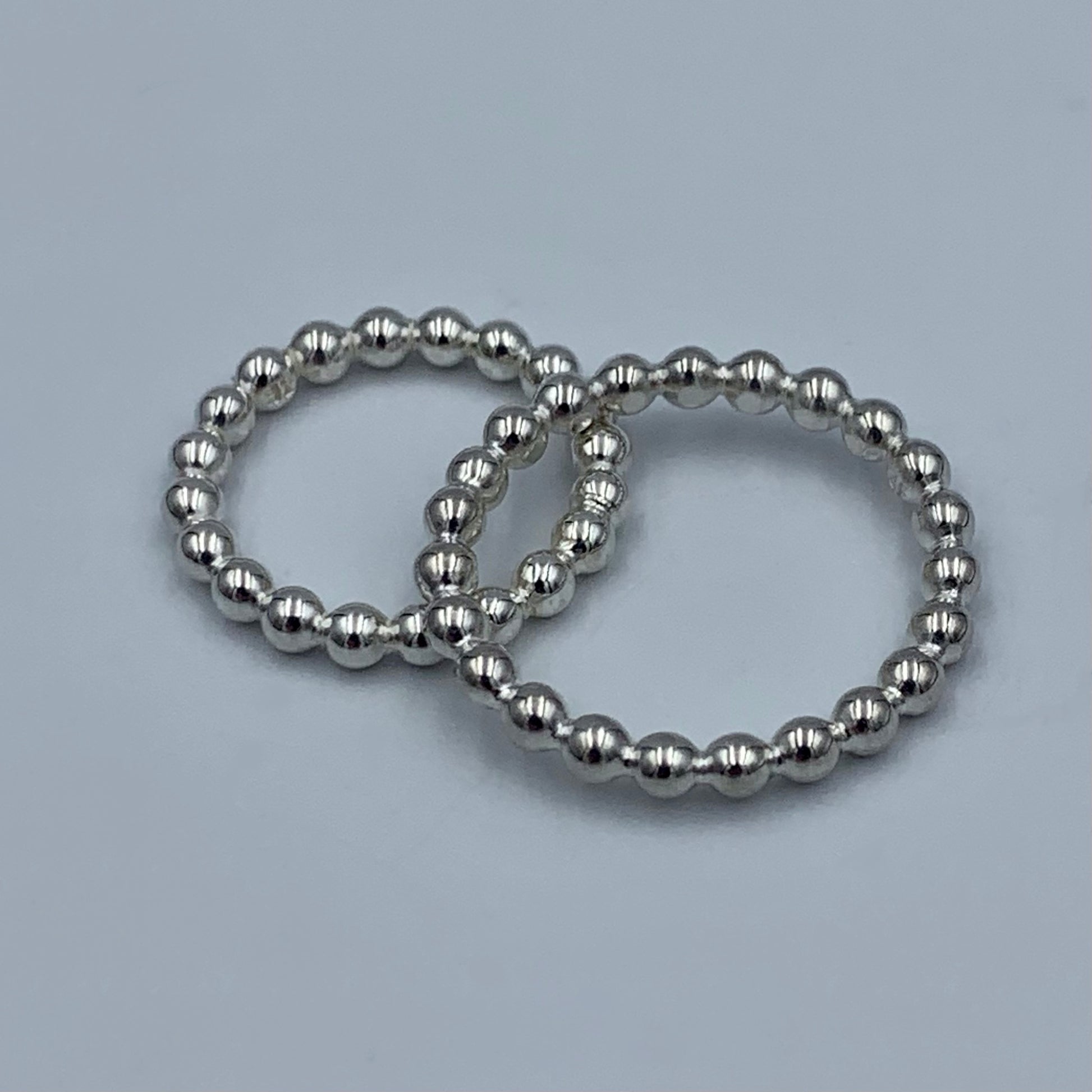 Sterling silver 3mm pearl bead stacking rings  showing different ring sizes