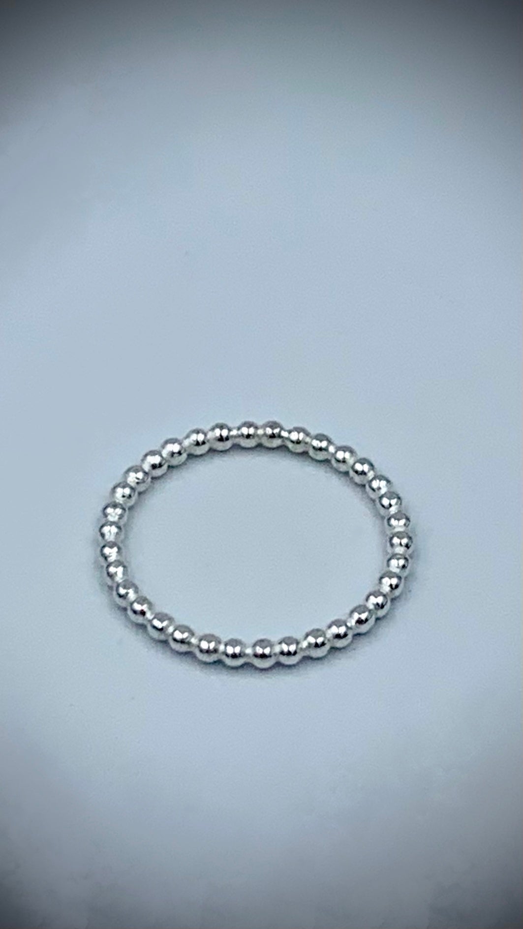 Sterling silver pearl bead stacking ring at slight angle showing 2mm bead detail