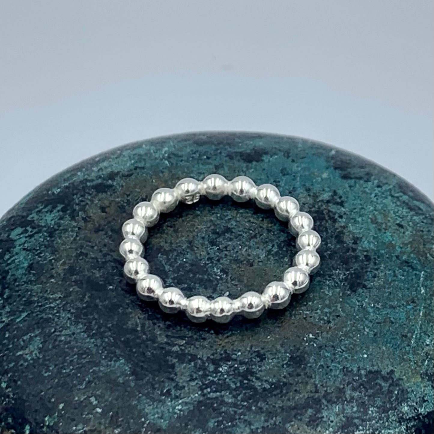 Sterling silver pearl bead stacking ring at slight angle showing 3mm bead detail